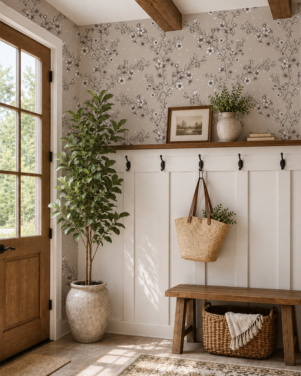 Blossom Whisper Soft Brown floral wallpaper in a warm entryway with white wainscoting, wood accents and a leafy plant.