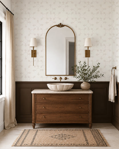 Boho Weave Linen wallpaper in a warm bathroom with a wood vanity, dark wainscoting and brass accents.
