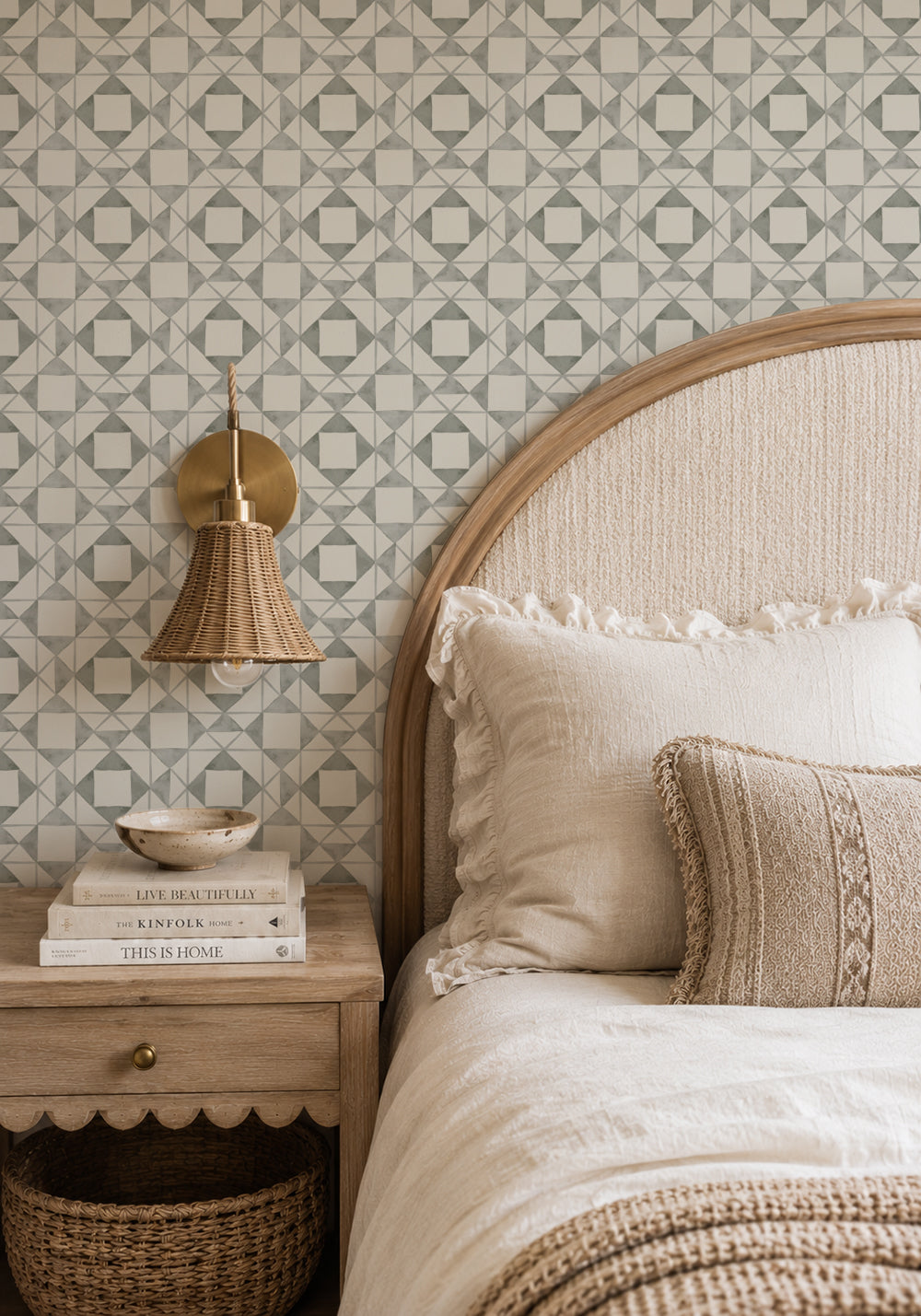 Classic Quilt Deep Sage wallpaper in a cozy bedroom with a curved wood headboard, cream bedding and woven lighting.
