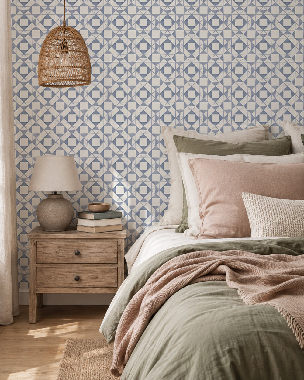 Classic Quilt Dusty Blue wallpaper in a cozy bedroom with wood furniture, cream bedding and soft blush accents.