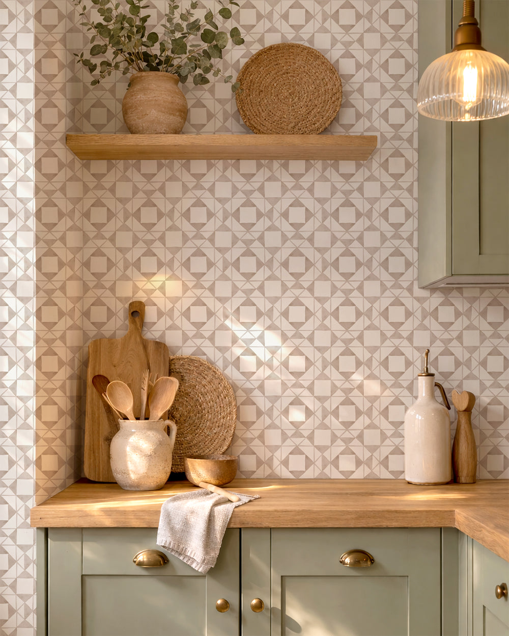 Classic Quilt Linen wallpaper in a cozy kitchen with green cabinets, wood counters and warm natural accents.