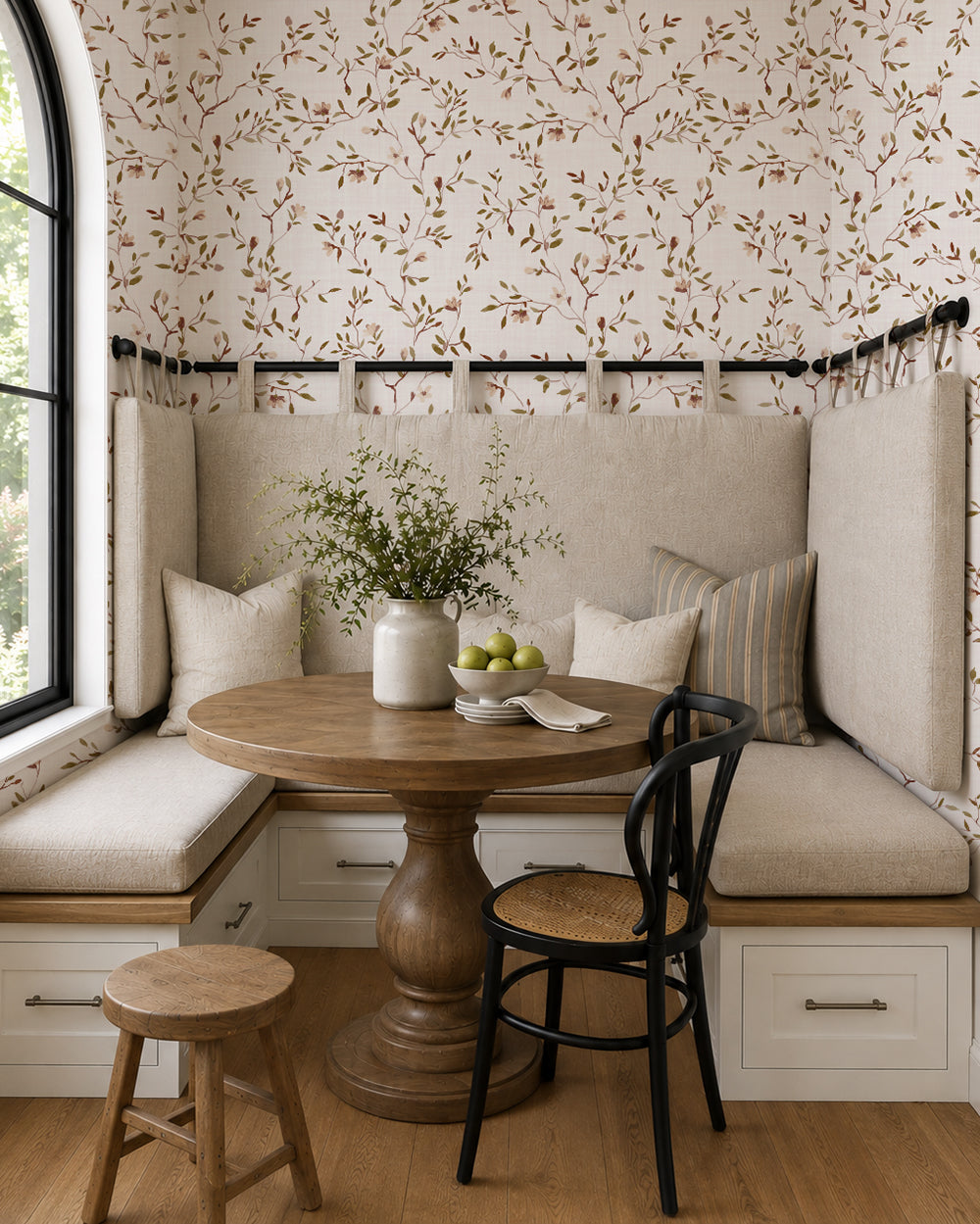 DelicateDreams floral wallpaper with olive and chestnut branches in a cozy dining nook with built-in seating and wood furniture.