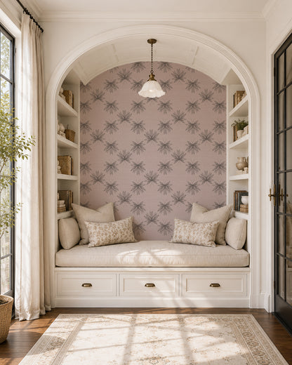 Flutter Dusty Blush wallpaper in a cozy reading nook with built-in shelves, cream cushions and soft natural light.