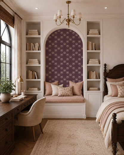 Flutter Plum wallpaper in an elegant bedroom nook with built-in shelves, warm wood furniture and soft blush accents.