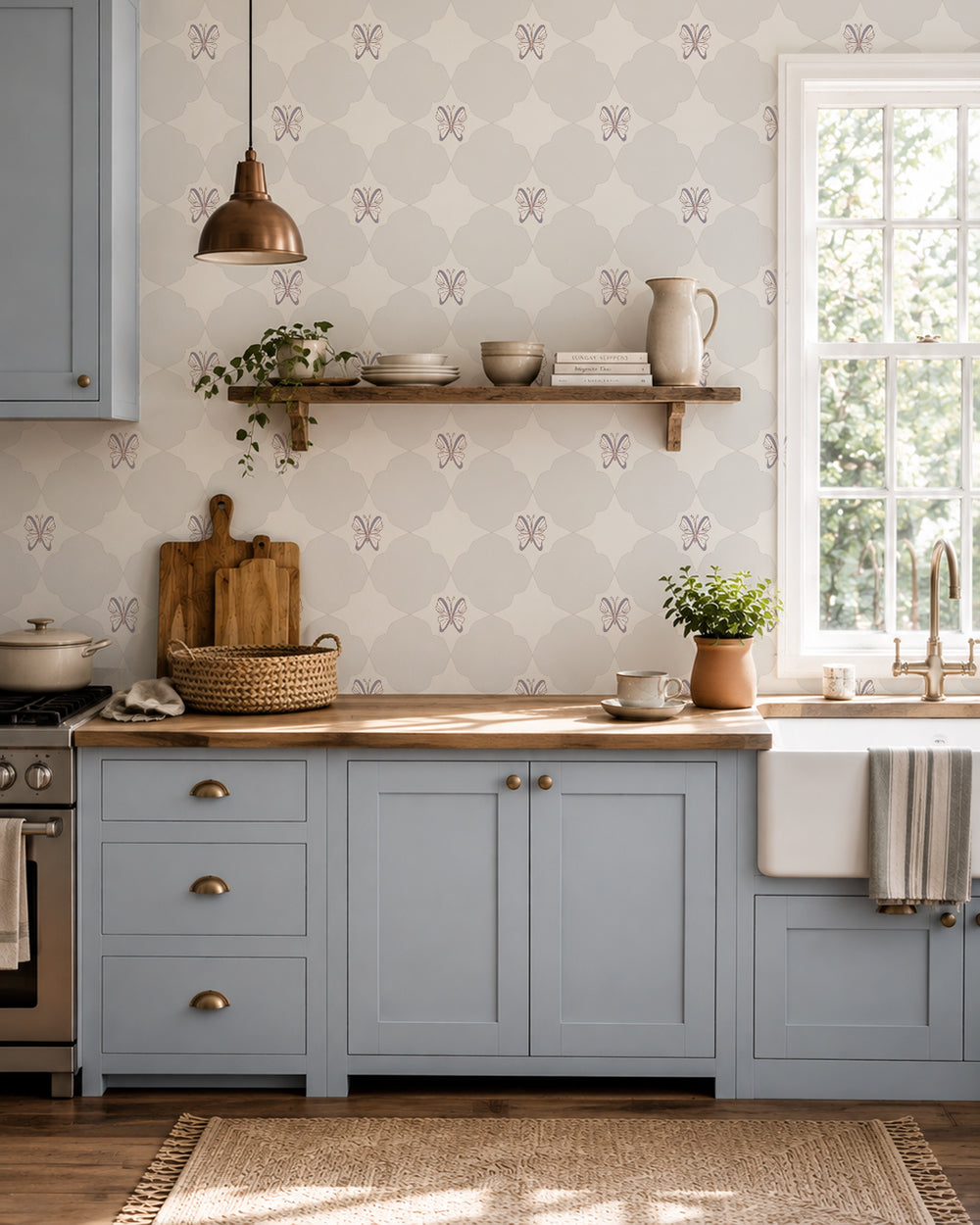 Keepsake Linen wallpaper in a cozy kitchen with dusty blue cabinets, wood counters and open shelving.