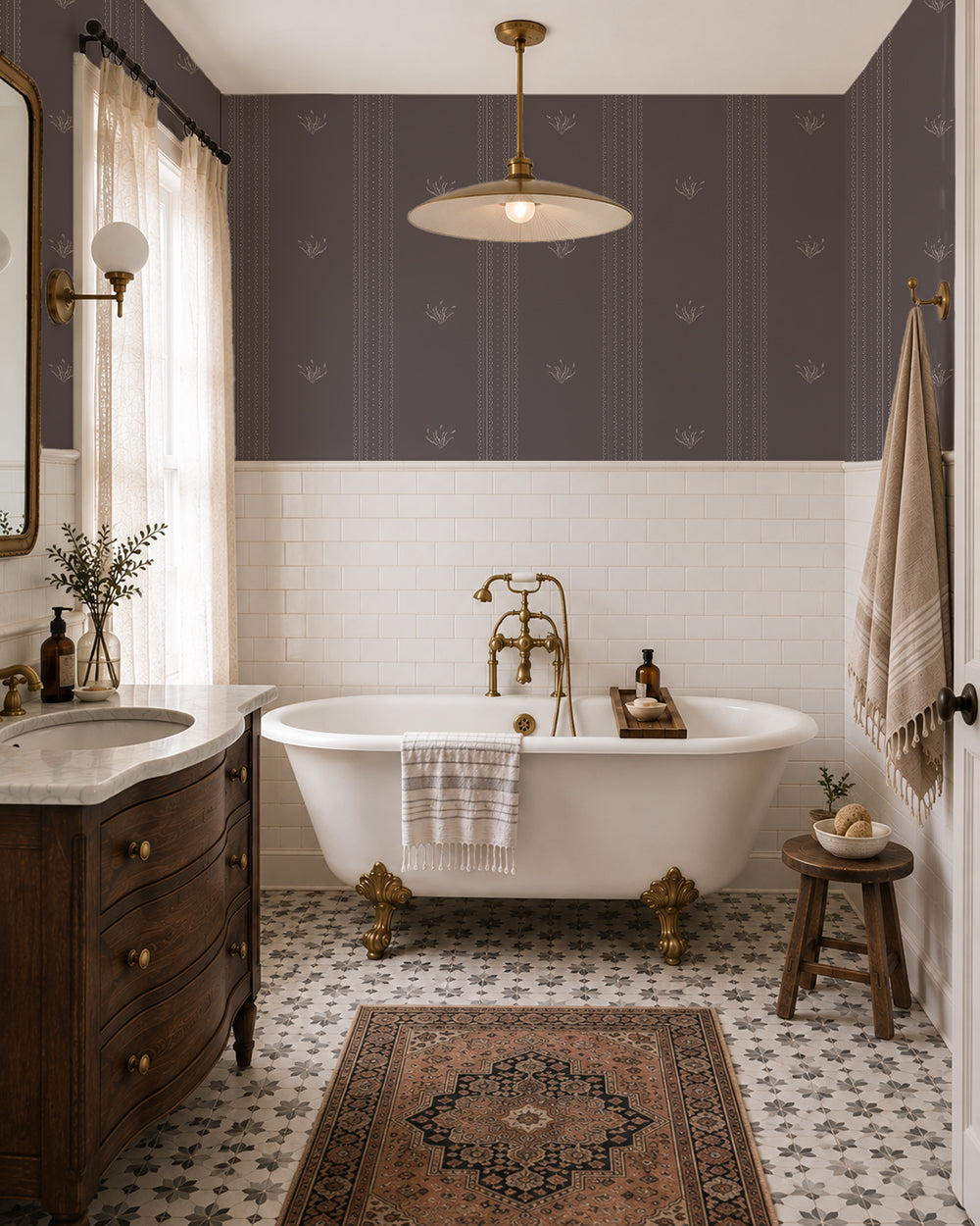 Lace Garden Warm Brown wallpaper in an elegant bathroom with a white tub, dark wood vanity and brass fixtures.