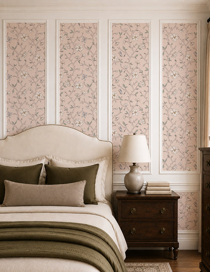 Magnolia Bloom Blush wallpaper in an elegant bedroom with cream bedding, dark wood furniture and soft green accents.