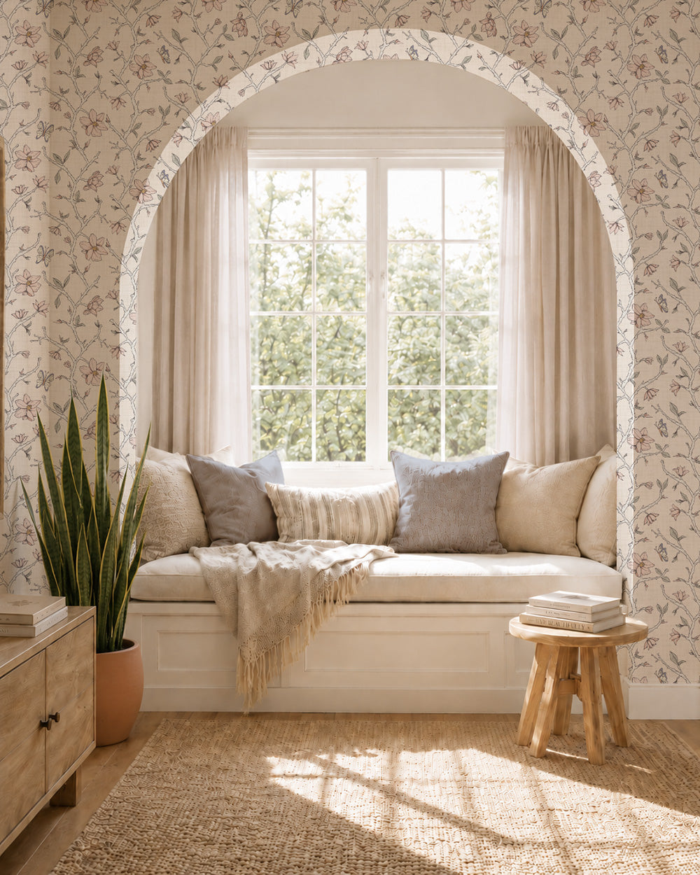 Magnolia Bloom Cream wallpaper in a bright window nook with built-in seating, neutral cushions and natural wood accents.