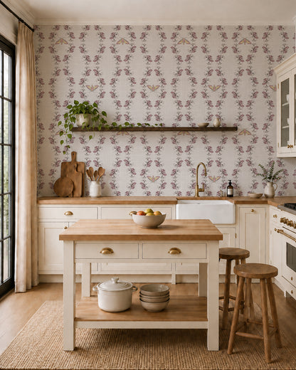 Night Bloom Warm Linen wallpaper in a cozy kitchen with cream cabinets, wood accents and a leafy plant.