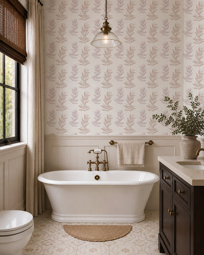 Olive Branch Linen wallpaper in a bright bathroom with a freestanding tub, dark wood vanity and cream wainscoting.