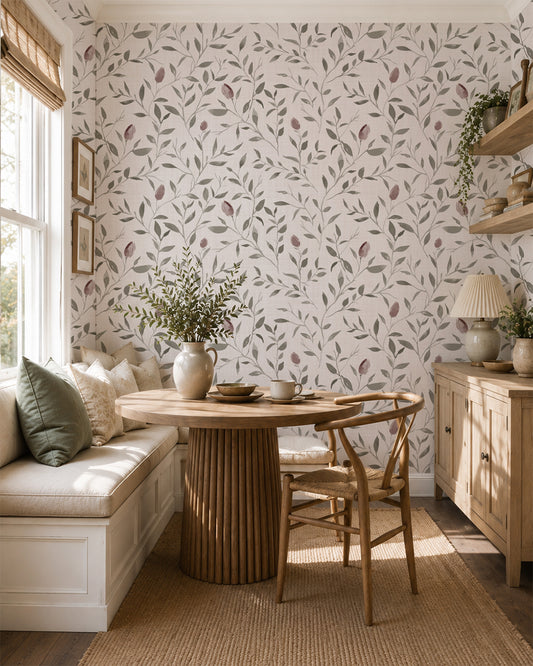 Rosebud Trail wallpaper with mauve rosebuds and leafy branches in a bright dining nook with warm wood furniture.