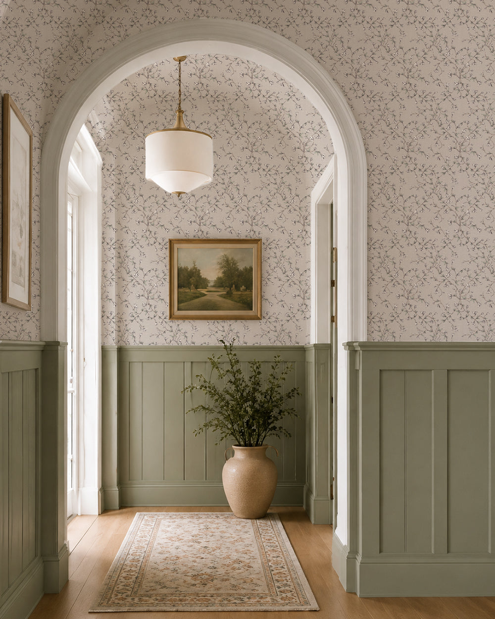 Spring Vine Taupe wallpaper in an elegant hallway with soft green wainscoting, arched doorways and warm natural light.
