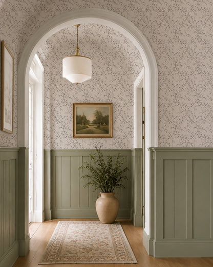 Spring Vine Taupe wallpaper in an elegant hallway with soft green wainscoting, arched doorways and warm natural light.