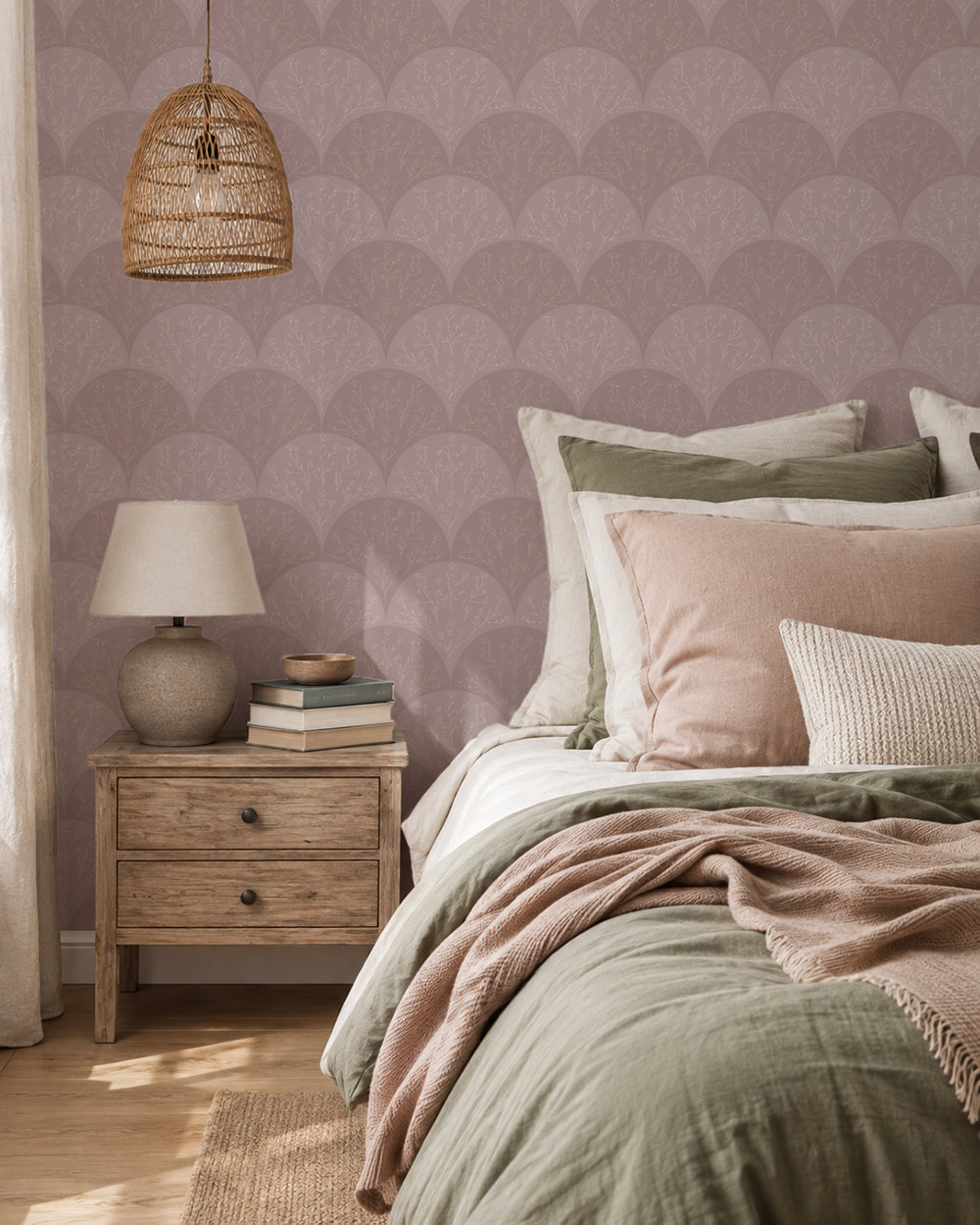 Stitched Meadow Blush wallpaper in a cozy bedroom with light wood furniture and soft pink and sage bedding.