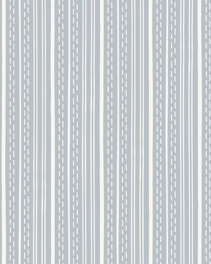 Ticking Stripe Dusty Blue wallpaper with hand-drawn blue stripes and dashed lines on a soft cream background.