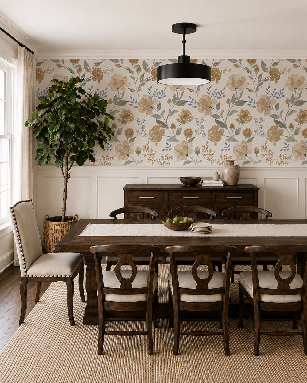 Vintage Peony Honey floral wallpaper in a warm dining room with dark wood furniture, cream wainscoting and natural accents.